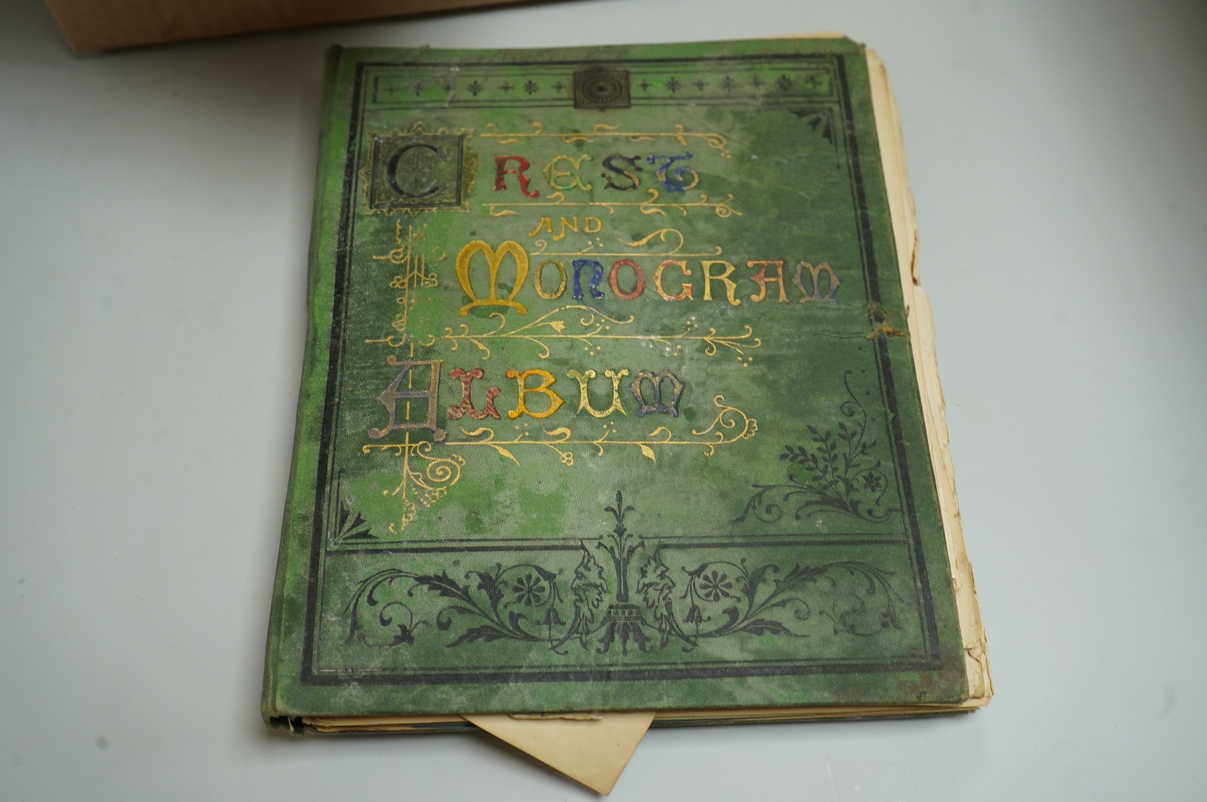 A collection of Victorian and later crest and monogram albums and loose crests and monograms